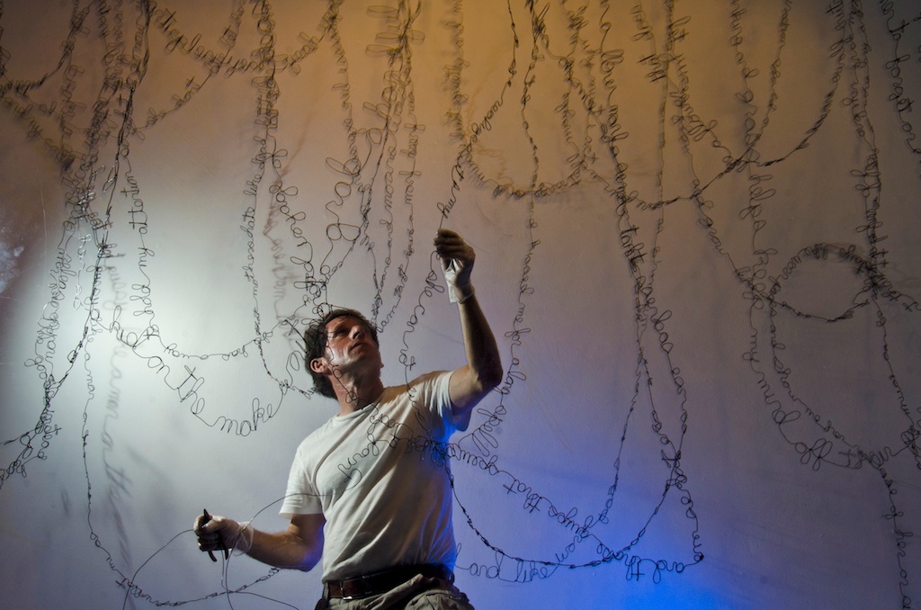 David Zalbern, a wire sculptor,  creates a wire poem inspired by women of his past during day five of a 41-day live art installation at ArtCenter South Florida Studios on Sunday, June 10, 2012 Miami Beach, Fla. Zalbern said the majority of the poem was instigated by a very specific woman. It was written with "reality and fantasy, and intermittent meanderings of others," Zalbern said.